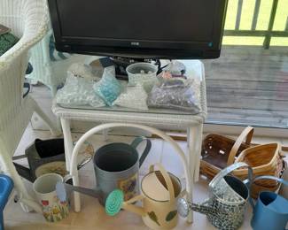 Watering cans, television