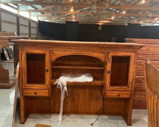 Custom wooden cabinet attachment for desk.