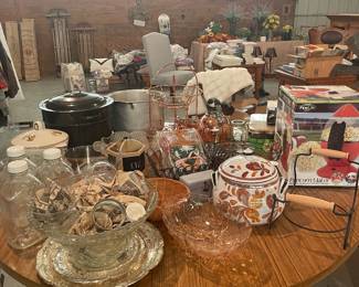 An array of unique kitchen items, canning equipment, crystal, baskets and racks