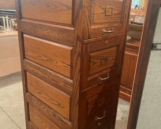 Solid Oak Executive Lateral File Cabinet – Heavy Duty  Beautiful solid oak lateral file cabinet with classic raised panel design and brass hardware.  This is a high-quality, heavy-duty piece—not the lightweight cabinets you find today. Perfect for a home office, study, or professional workspace.