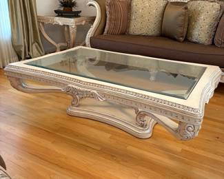 R10 - $1500. Benneti Italia Elegant Living Room Set. Oversized. Has ornate carved wood frames. Includes a comfy sofa, two armchairs, a coffee table with a glass top, and glass top side table. Upholstery is in brown and gold tones. Comes with decorative pillows.  DIMENSIONS:   Sofa approx. 8ft L x 3ft D x 4ft H. Large side chair 60”W x 38”D x 48”H.  Accent chair 31”W x 29”D x 45”H.  Side table 38”W x 38”D x 28”H.  Coffee table 63”L x 41”W x 19.5”H 