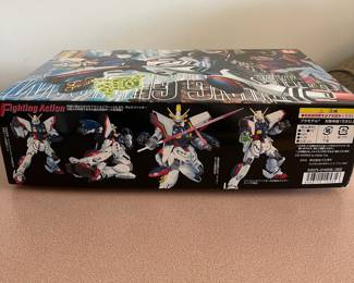 R37 - $25. Bandai MG Shining Gundam Plastic Model Kit. Open box but looks complete. 