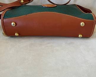 R48 - $30. Vintage Dooney & Bourke Green & Tan Crossbody Bag. Measures 10" wide x 7" tall x 3" deep. 