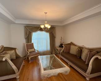 R10 - $1500. Benneti Italia Elegant Living Room Set. Oversized. Has ornate carved wood frames. Includes a comfy sofa, two armchairs, a coffee table with a glass top, and glass top side table. Upholstery is in brown and gold tones. Comes with decorative pillows.  DIMENSIONS:   Sofa approx. 8ft L x 3ft D x 4ft H. Large side chair 60”W x 38”D x 48”H.  Accent chair 31”W x 29”D x 45”H.  Side table 38”W x 38”D x 28”H.  Coffee table 63”L x 41”W x 19.5”H 