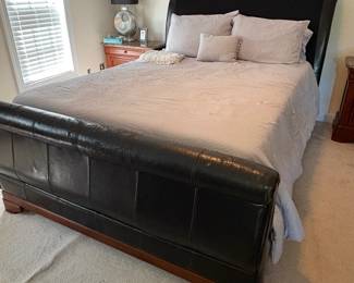 R9 - $50. Queen Size Faux Leather Bed. Has significant peeling. Mattress included if you'd like it. 