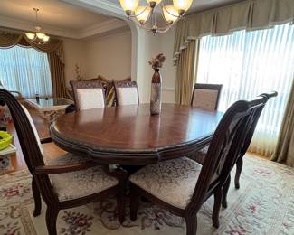 R11 - $750. Michael Amini Signature Series by AICO Hazelnut “Villagio” table & chairs wood dining table set & china cabinet.  Table does have some surface scratches and Table has 6 upholstered chairs and extendable leaf for flexible sizing. Chairs have leaf patterned fabric seats and backs, with carved wood frames.  DIMENSIONS:   Table w/ leaf 84” L x 60” W x 31”H  Leaf 24”W  Arm Chair  Seat 27.25”W x 24.25 D x 45”H  Side Chair Seat 24”W x 24.25 D x 45”H Floor to seat 19”  China Cabinet  Dimensions: 88 1/2"H x 66"W x 19"D Features Built in 3-mood touch lighting system