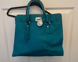 R44 - $45. Michael Kors Large Hamilton Bag. Measures 14" wide x 4.5" deep x 11" tall. 