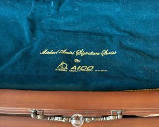 R11 - $750. Michael Amini Signature Series by AICO Hazelnut “Villagio” table & chairs wood dining table set & china cabinet.  Table does have some surface scratches and Table has 6 upholstered chairs and extendable leaf for flexible sizing. \  DIMENSIONS:  China Cabinet  Dimensions: 88 1/2"H x 66"W x 19"D Features Built in 3-mood touch lighting system