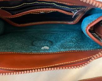 R48 - $30. Vintage Dooney & Bourke Green & Tan Crossbody Bag. Measures 10" wide x 7" tall x 3" deep. 