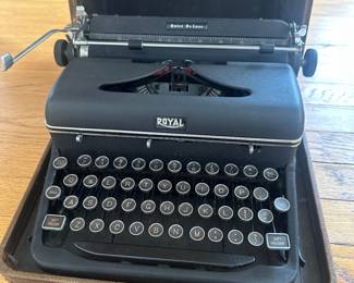 R79 - $50. Royal Quiet De Luxe Typewriter. All keys move - none are stuck. Has hard case that is in rough condition. 