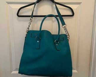 R44 - $45. Michael Kors Large Hamilton Bag. Measures 14" wide x 4.5" deep x 11" tall. 