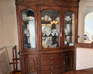 R11 - $750. Michael Amini Signature Series by AICO Hazelnut “Villagio” table & chairs wood dining table set & china cabinet.  Table does have some surface scratches and Table has 6 upholstered chairs and extendable leaf for flexible sizing. \  DIMENSIONS:  China Cabinet  Dimensions: 88 1/2"H x 66"W x 19"D Features Built in 3-mood touch lighting system