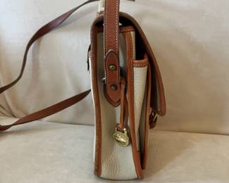 R47 - $20. Vintage Dooney & Bourke Calvary Crossbody. Measures 9" x 9" x 3". Has been used - the white leather needs cleaned. 