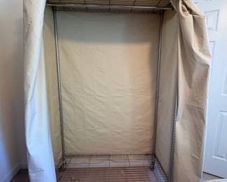 R95 - 2 Available. $75 Each. Rolling Metal Hanging Clothes Racks with Canvas Covers. 