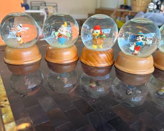 R83 - $25. 8 Pc Disney Snow Globes. 