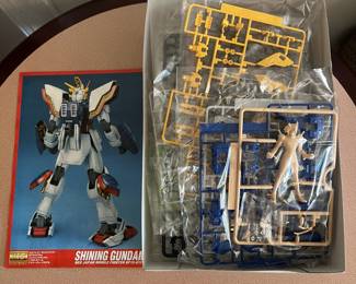 R37 - $25. Bandai MG Shining Gundam Plastic Model Kit. Open box but looks complete. 