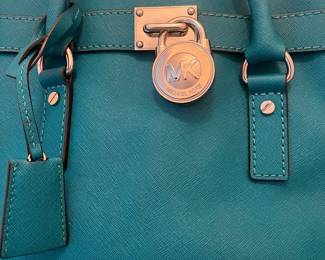 R44 - $45. Michael Kors Large Hamilton Bag. Measures 14" wide x 4.5" deep x 11" tall. 