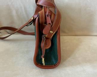 R48 - $30. Vintage Dooney & Bourke Green & Tan Crossbody Bag. Measures 10" wide x 7" tall x 3" deep. 