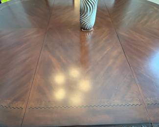 R11 - $750. Michael Amini Signature Series by AICO Hazelnut “Villagio” table & chairs wood dining table set & china cabinet.  Table does have some surface scratches and Table has 6 upholstered chairs and extendable leaf for flexible sizing. Chairs have leaf patterned fabric seats and backs, with carved wood frames.  DIMENSIONS:   Table w/ leaf 84” L x 60” W x 31”H  Leaf 24”W  Arm Chair  Seat 27.25”W x 24.25 D x 45”H  Side Chair Seat 24”W x 24.25 D x 45”H Floor to seat 19”  China Cabinet  Dimensions: 88 1/2"H x 66"W x 19"D Features Built in 3-mood touch lighting system