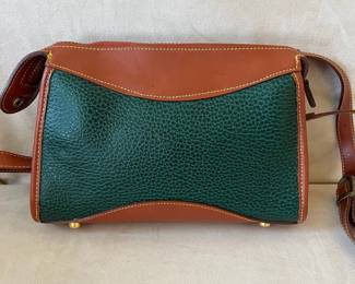 R48 - $30. Vintage Dooney & Bourke Green & Tan Crossbody Bag. Measures 10" wide x 7" tall x 3" deep. 