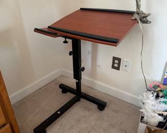 R77 - $20. Adjustable Desk. Height and angles are adjustable. 