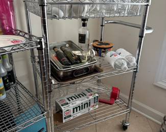 R15 - $30. Stainless 3 Tier Rolling Cart. Measures 28" x 18" x 39" tall. Has been used in the kitchen and needs cleaned up. Stainless with adjustable shelves. 