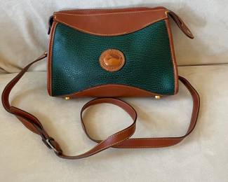 R48 - $30. Vintage Dooney & Bourke Green & Tan Crossbody Bag. Measures 10" wide x 7" tall x 3" deep. 