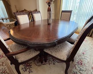 R11 - $750. Michael Amini Signature Series by AICO Hazelnut “Villagio” table & chairs wood dining table set & china cabinet.  Table does have some surface scratches and Table has 6 upholstered chairs and extendable leaf for flexible sizing. Chairs have leaf patterned fabric seats and backs, with carved wood frames.  DIMENSIONS:   Table w/ leaf 84” L x 60” W x 31”H  Leaf 24”W  Arm Chair  Seat 27.25”W x 24.25 D x 45”H  Side Chair Seat 24”W x 24.25 D x 45”H Floor to seat 19”  China Cabinet  Dimensions: 88 1/2"H x 66"W x 19"D Features Built in 3-mood touch lighting system