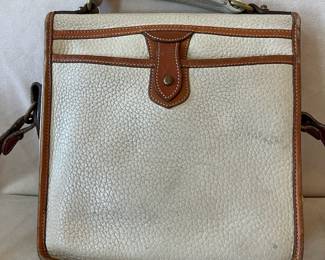 R47 - $20. Vintage Dooney & Bourke Calvary Crossbody. Measures 9" x 9" x 3". Has been used - the white leather needs cleaned. 