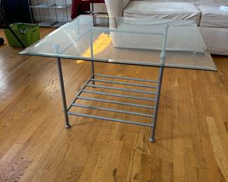 R75 - $30. Glass Top Coffee Table. Measures 34" square x 22.5" tall. 