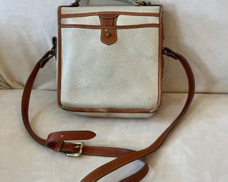 R47 - $20. Vintage Dooney & Bourke Calvary Crossbody. Measures 9" x 9" x 3". Has been used - the white leather needs cleaned. 