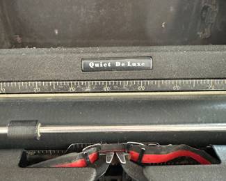 R79 - $50. Royal Quiet De Luxe Typewriter. All keys move - none are stuck. Has hard case that is in rough condition. 