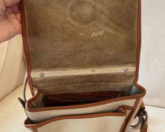 R47 - $20. Vintage Dooney & Bourke Calvary Crossbody. Measures 9" x 9" x 3". Has been used - the white leather needs cleaned. 
