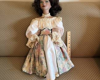 R86 - $50. Patricia Loveless "Regina" Victorian "Black Creole" Porcelain Doll. 28" tall.  Has small mark on her nose. 