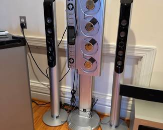 R28 - $35. Sharper Image Quattro 4-CD AM/FM Stereo with Dock for iPod. Model SA267. CD Player with pair of floor speakers.  Manufactured 2006. 