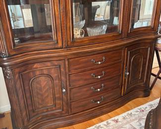 R11 - $750. Michael Amini Signature Series by AICO Hazelnut “Villagio” table & chairs wood dining table set & china cabinet.  Table does have some surface scratches and Table has 6 upholstered chairs and extendable leaf for flexible sizing. \  DIMENSIONS:  China Cabinet  Dimensions: 88 1/2"H x 66"W x 19"D Features Built in 3-mood touch lighting system