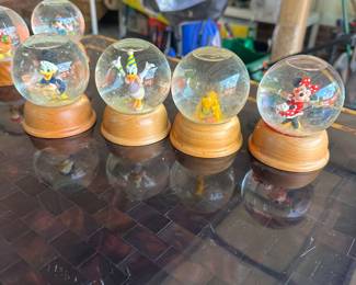 R83 - $25. 8 Pc Disney Snow Globes. 