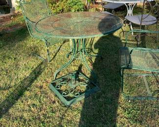 Heavy wrought iron green table with umbrella center stand
