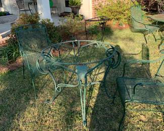 Heavy old green glass top table. Set 4 wrought iron chairs
