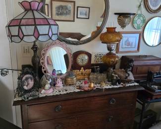 Antique low boy dresser vintage antique-look lamps, clocks, lots of trinkets
