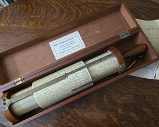 Fuller's cylinder slide rule with case and instruction book