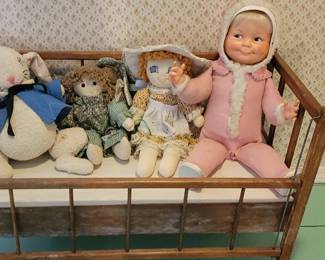 Toy crib and dolls
