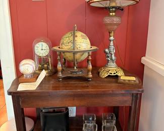 Antique Side Table Parlor Lamp White Shade Globe Clock Glasses Red Wall