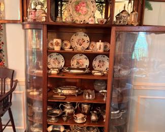 Antique China Cabinet with Decorative Plates and Silver