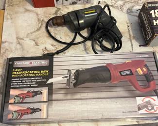 Unopened Reciprocating Saw and a drill
