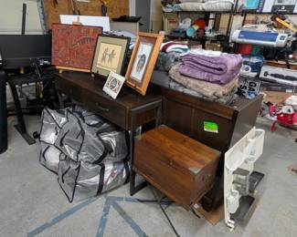 Vintage writing desk with stand, pegboard, Native American art, entry table, large bags full of women's clothes.
