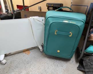 Portable or mountable convection space heater, leather suitcase/luggage.