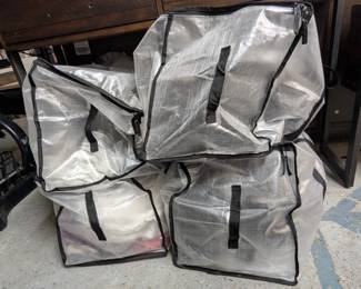 Large bags of women's clothing including jeans, sweats, leggings, shorts, skirts, T-shirts, blouses, dresses, coats, jackets, scarves, gloves, hats, and more.