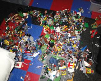 thousands of Legos some built up others loose
