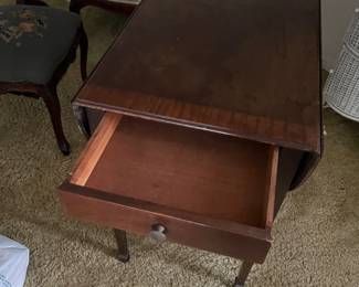 Padfoot table with drawer open. 